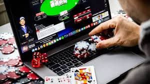 Casino Hold'em dealer interface showing community cards and live video feed